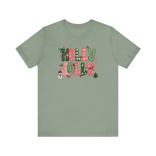 Holly Jolly Tee featuring festive candy-cane lettering and Christmas motifs, including snowmen and candy canes, on a soft, unisex short sleeve T-shirt.