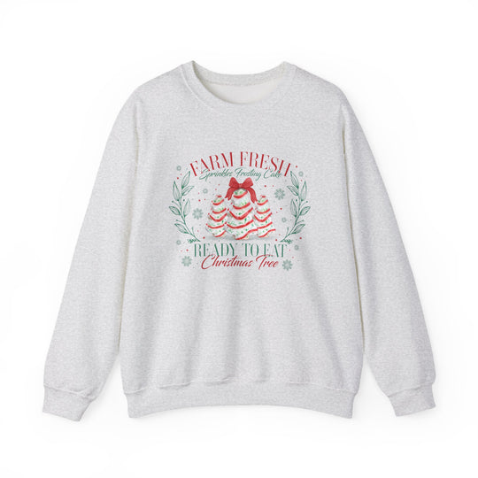 Light-heather gray sweatshirt featuring playful Christmas-themed frosting tree design, Farm Fresh Sprinkles Frosting Cake, perfect for cozy holiday wear from Faith Family Designs.