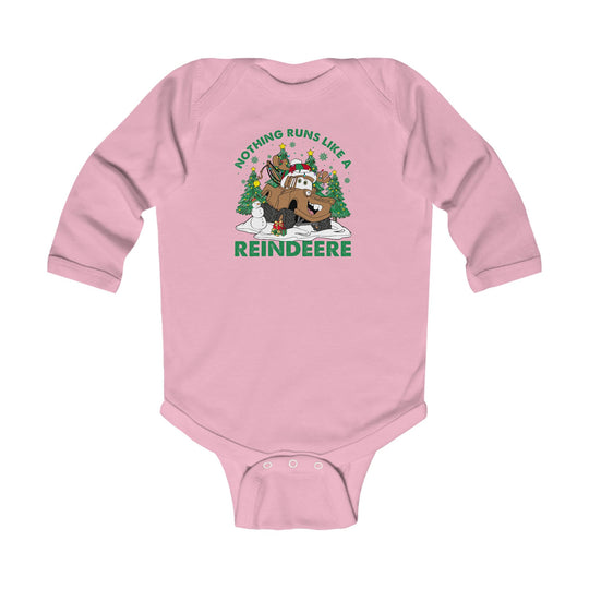 Reindeere Onesie: Light-pink baby bodysuit featuring a festive reindeer tractor cartoon with antlers, Santa hat, Christmas trees, snowman, and gift, plus pun slogan for holiday cheer.