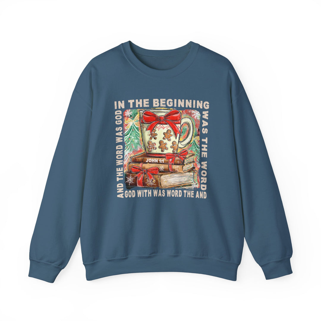 Blue crew-neck sweatshirt with holiday graphic: a steaming mug, gingerbread, books, fir trees, and John 1:1 text. Cozy cotton-polyester blend for comfort.