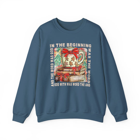 Blue crew-neck sweatshirt with holiday graphic: a steaming mug, gingerbread, books, fir trees, and John 1:1 text. Cozy cotton-polyester blend for comfort.