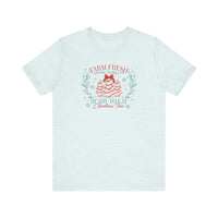 Unisex cotton tee with playful holiday design featuring cake-shaped Christmas trees and festive slogans, Farm Fresh Sprinkles Frosting Cake and Ready to Eat Christmas Tree.