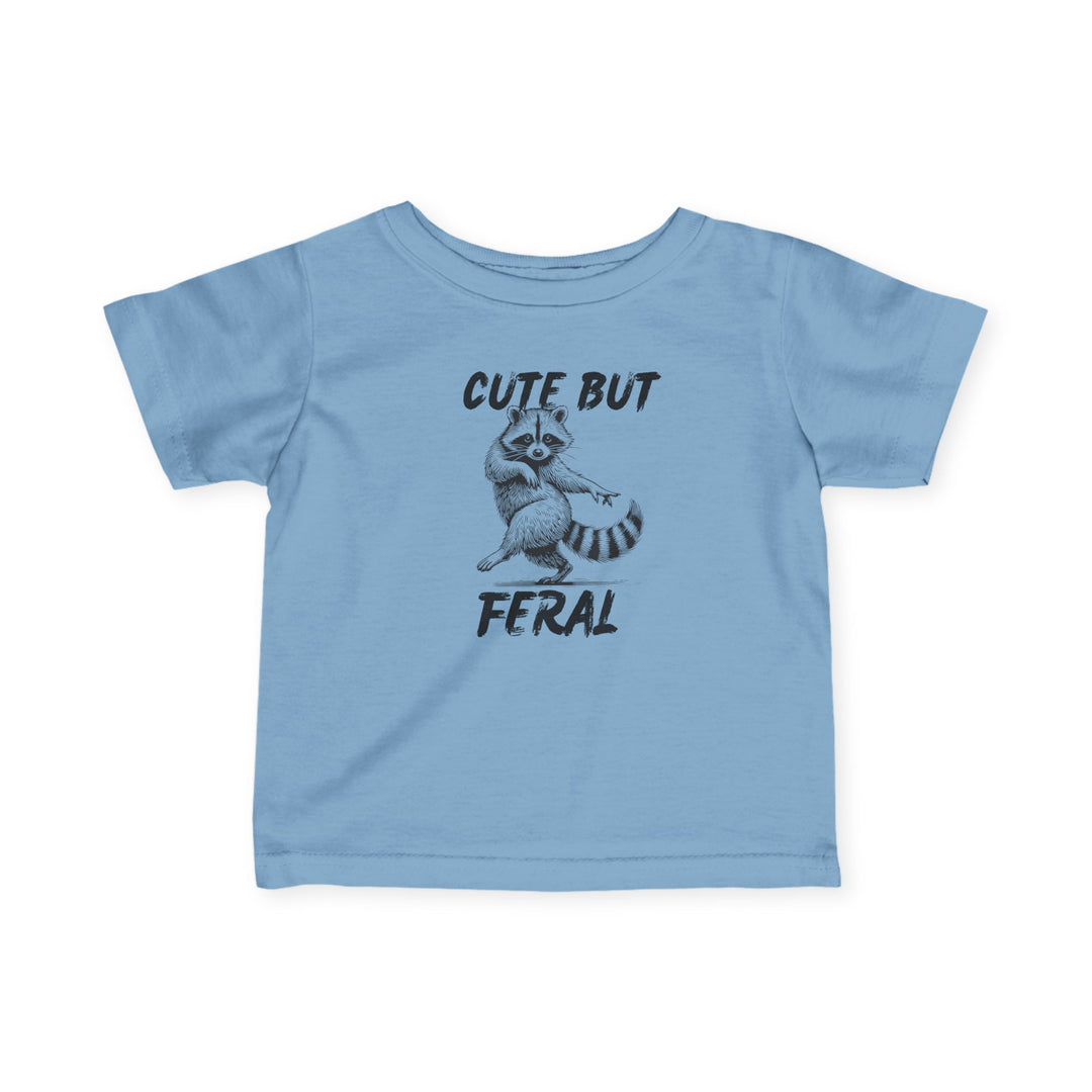 Cute but Feral Baby Tee featuring a cartoon raccoon and bold slogan, designed for comfort and durability with 100% combed cotton. Ideal for toddlers.