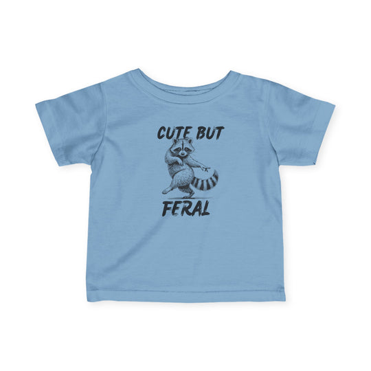 Cute but Feral Baby Tee featuring a cartoon raccoon and bold slogan, designed for comfort and durability with 100% combed cotton. Ideal for toddlers.