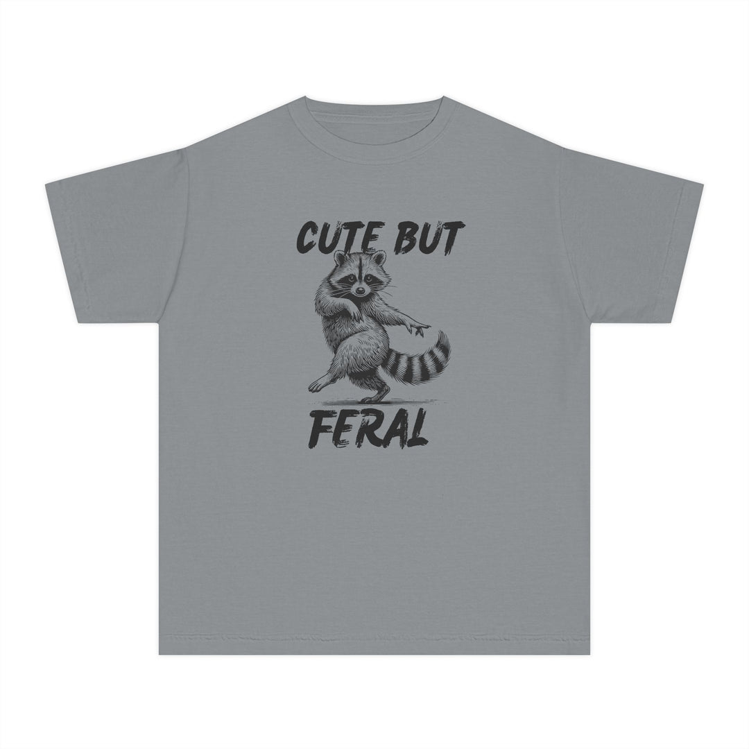 Cute but Feral Kids Tee features a playful raccoon illustration with CUTE BUT above and FERAL below, perfect for active kids seeking comfort and style.