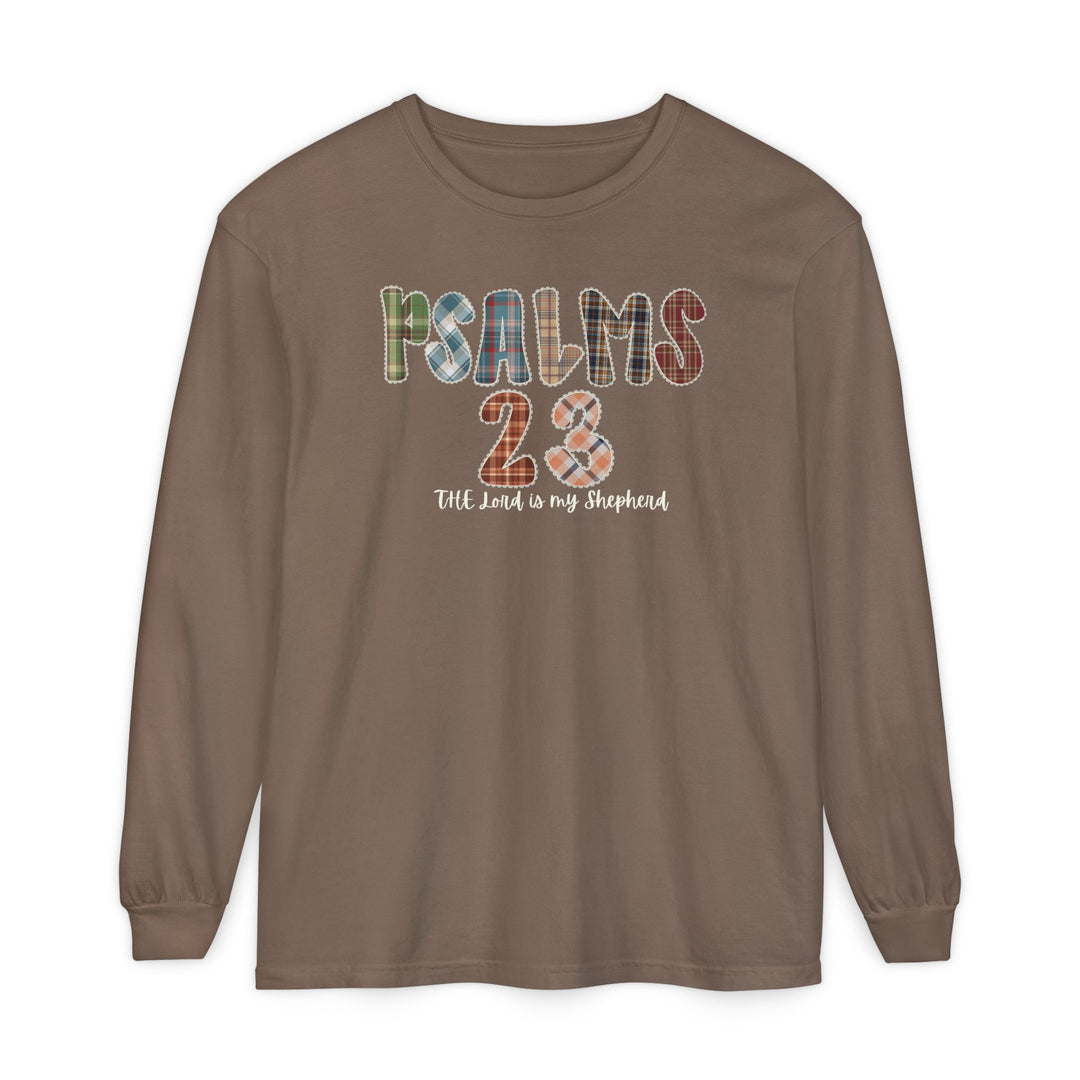 Psalms 23 Long Sleeve Tee featuring multicolored, plaid-patterned PSALMS 23 and cursive The Lord is my Shepherd on soft, garment-dyed, 100% ring-spun cotton fabric.
