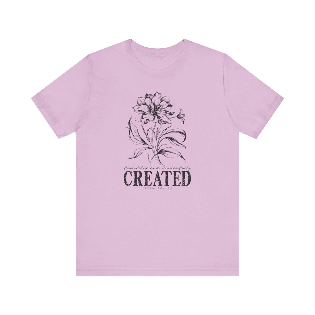 Unisex Created Tee with a crew neckline, soft cotton, and ribbed knit collars for a classic fit. Ideal for casual or semi-formal occasions.