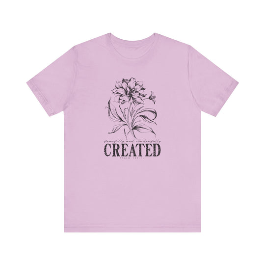 Unisex Created Tee with a crew neckline, soft cotton, and ribbed knit collars for a classic fit. Ideal for casual or semi-formal occasions.
