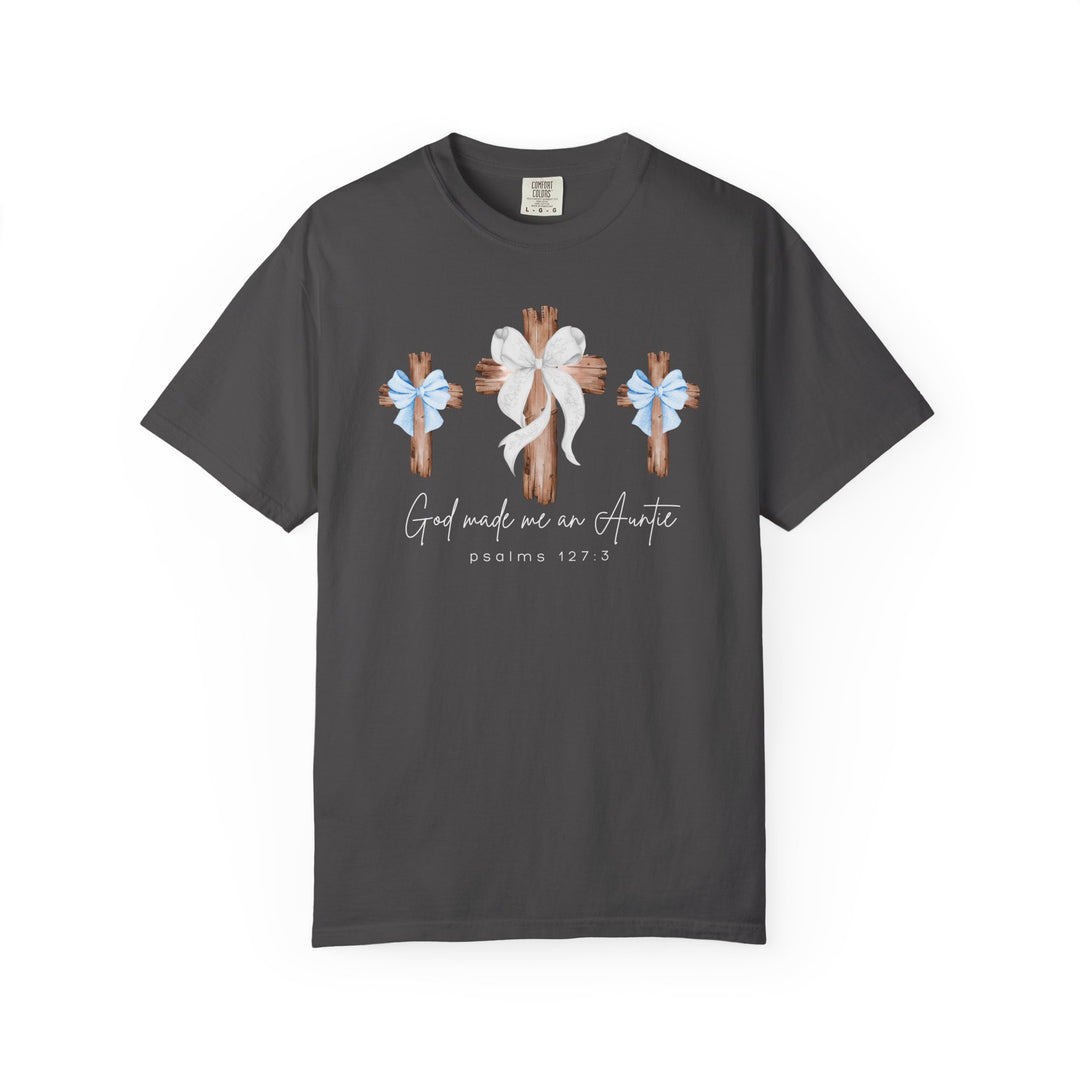 Dark-charcoal crew-neck T-shirt featuring three wooden crosses with ribbons, text God made me an Auntie, and psalms 127:3 below. Comfortable fit, durable.