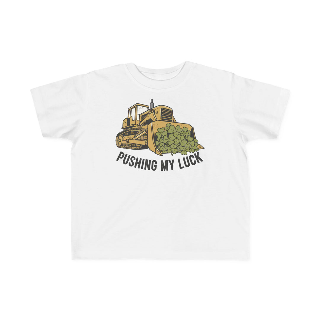 Pushing My Luck Toddler Tee featuring a cartoon yellow bulldozer with four-leaf clovers and slogan, offers softness and durability for toddlers.