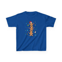 Gingerbread Stack Kids Tee features stacked gingerbread men with Santa hat, candy canes, and holiday motifs on a bright blue T-shirt.