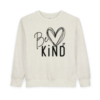 Be Kind Toddler Crew: Cream crewneck sweatshirt featuring 'Be Kind' design with heart graphic, offering warmth and comfort for toddlers.