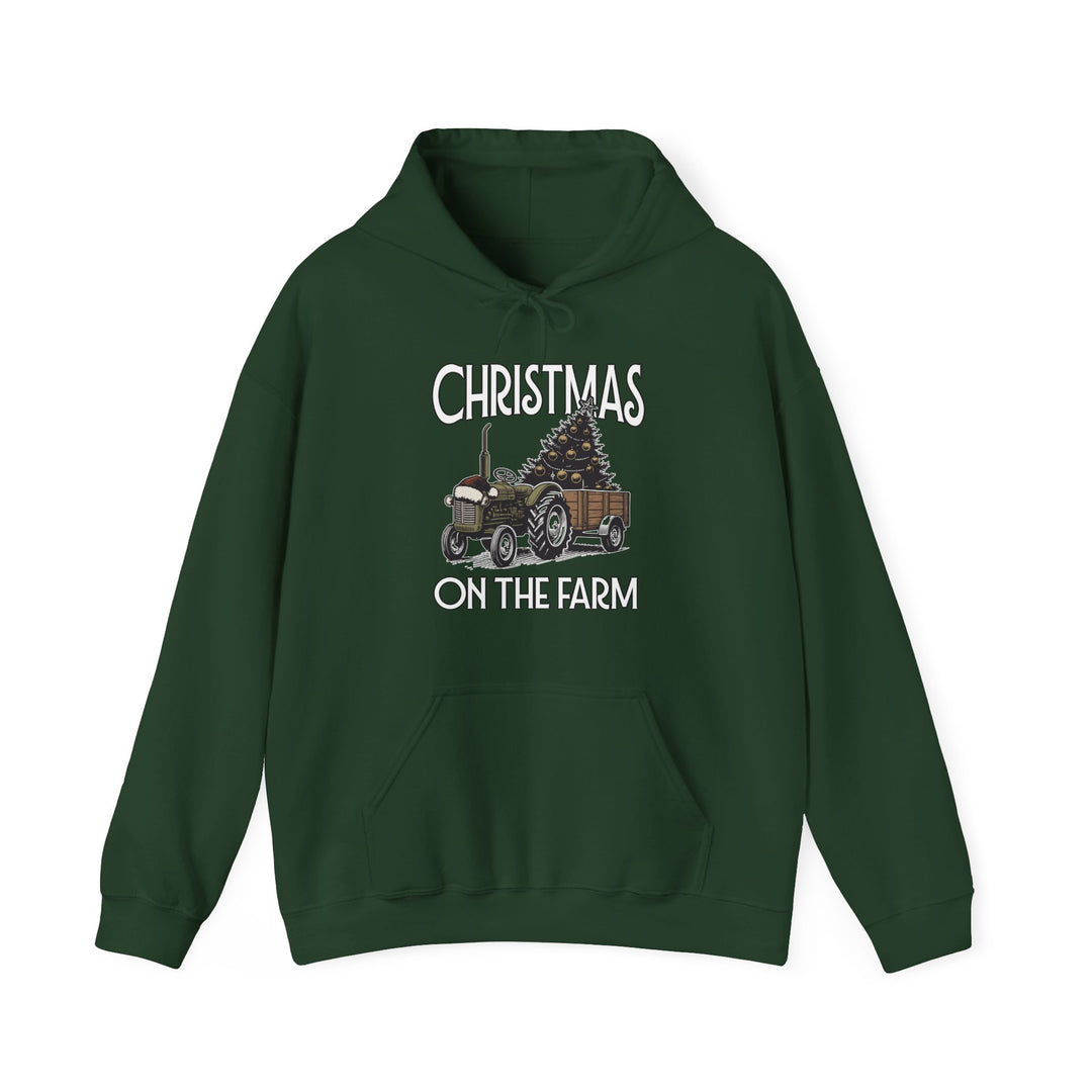 Dark green Christmas at the Farm hoodie featuring a vintage tractor with a Christmas tree graphic and kangaroo pocket, offering warmth and comfort.