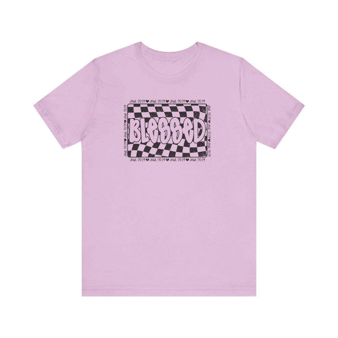 Blessed Tee: Pink t-shirt featuring a black and white checkered design, crafted from soft cotton with ribbed knit collars and dual side seams for durability.