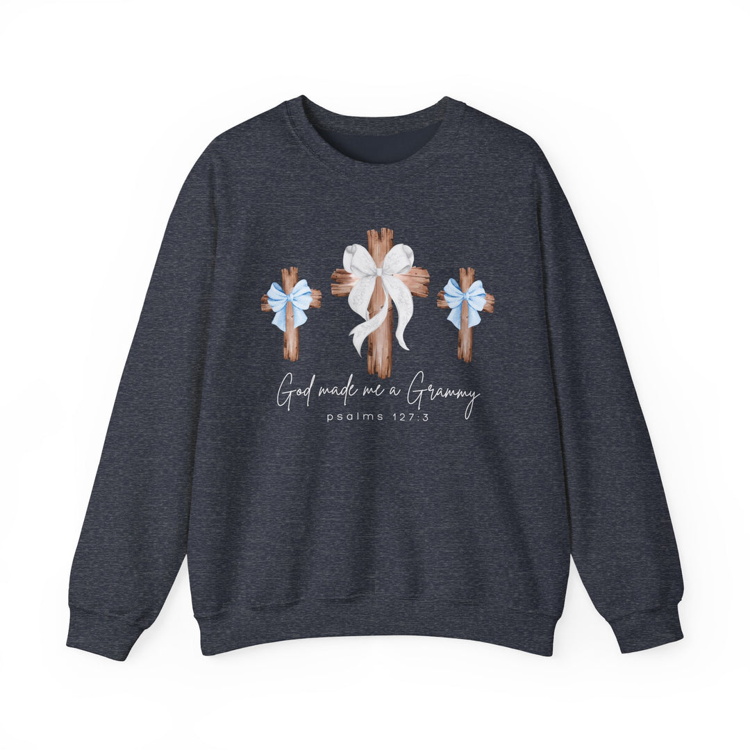 Dark-heather navy crewneck sweatshirt featuring three wooden crosses and 'God made me a Grammy' graphic, offering comfort with its cotton-polyester blend and ribbed collar.