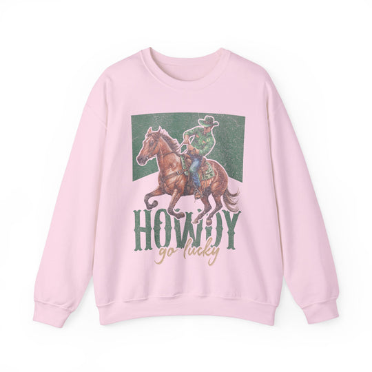 Howdy Go Lucky Crew: A pink sweatshirt featuring a cowboy riding a horse, made from a cotton-polyester blend for comfort and durability with a ribbed collar.