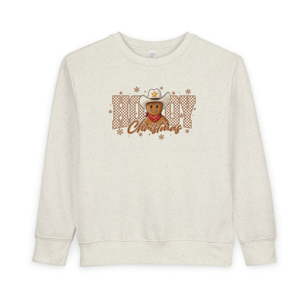 Howdy Christmas Toddler Crewneck features a cowboy gingerbread graphic with snowflakes, blending festive and western themes, ideal for cozy, stylish comfort.