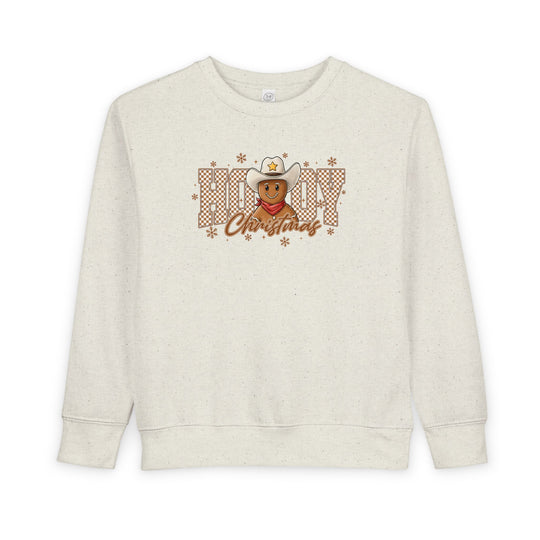 Howdy Christmas Toddler Crewneck features a cowboy gingerbread graphic with snowflakes, blending festive and western themes, ideal for cozy, stylish comfort.