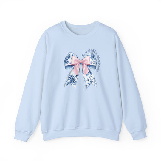 Light-blue crewneck sweatshirt with floral bow graphic and cursive text it is well with my soul, epitomizing comfort and style from Faith Family Designs.