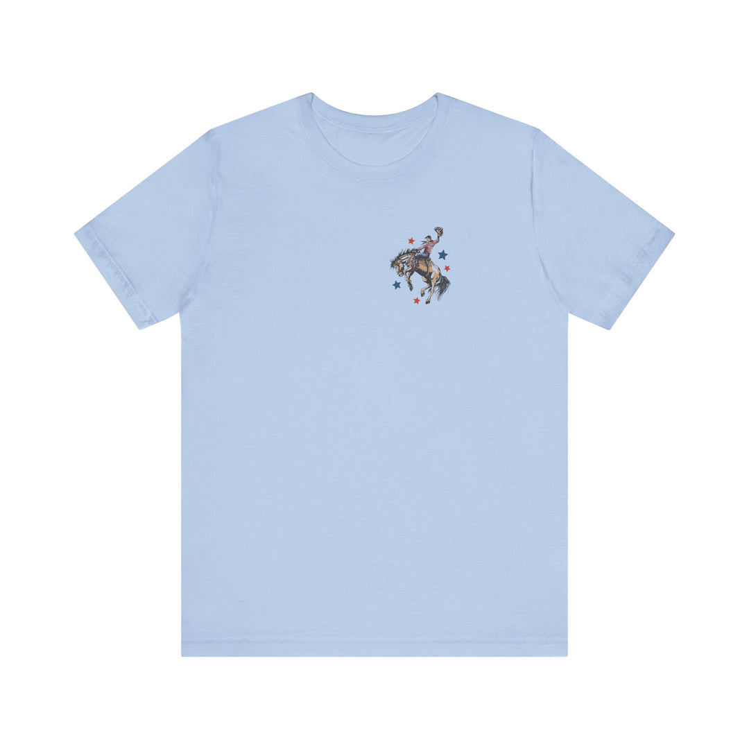 Light-blue 'Make America Country Again Tee' with rodeo scene chest print, featuring cowboy on bronco, surrounded by stars; classic unisex fit, soft cotton.