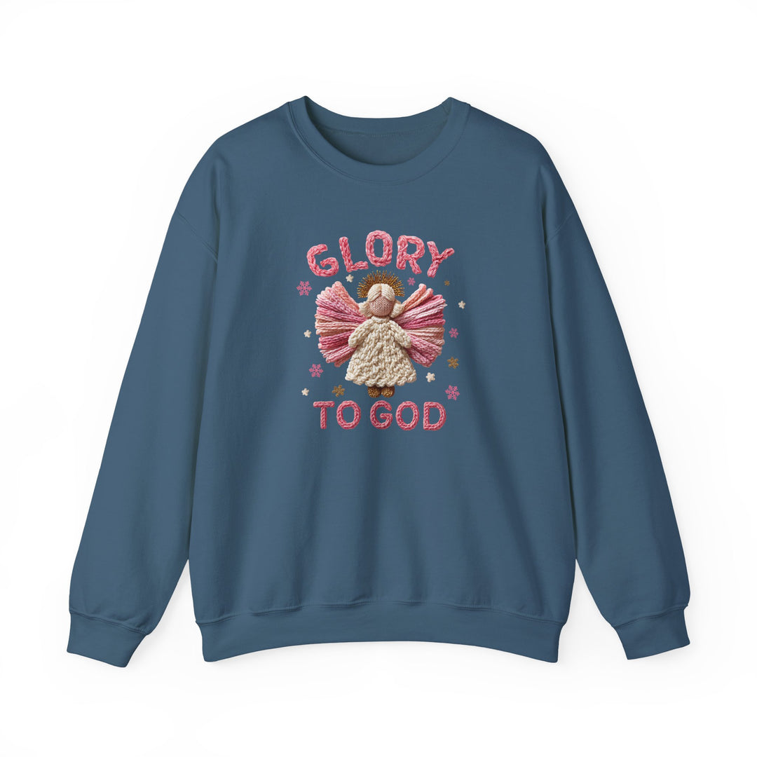 Blue crew-neck sweatshirt featuring a yarn-style angel illustration with GLORY TO GOD text, stars, and snowflakes; combines polyester-cotton blend for comfort.