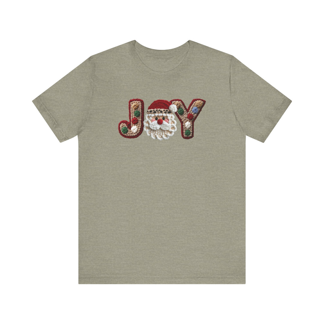 Heather-olive short-sleeve Joy Tee with JOY in tufted letters, Santa face as O, and ornament accents, showcasing festive design on soft cotton fabric.