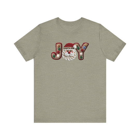 Heather-olive short-sleeve Joy Tee with JOY in tufted letters, Santa face as O, and ornament accents, showcasing festive design on soft cotton fabric.