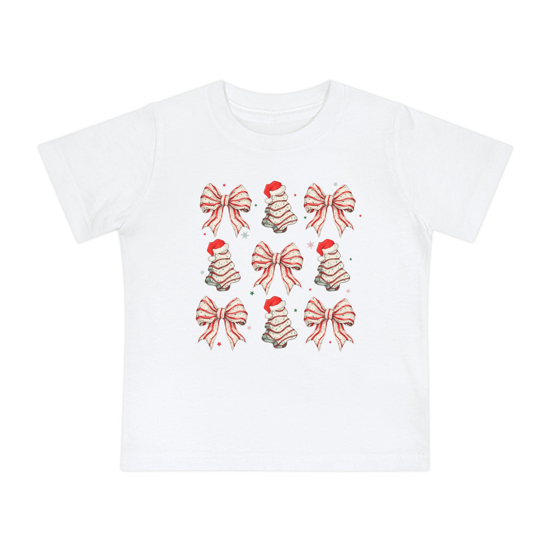 Cookies and Bows Baby Tee features a festive 3x3 grid of candy-cane bows and Christmas trees, perfect for stylish, comfortable wear in durable, shrink-resistant cotton.