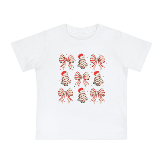 Cookies and Bows Baby Tee features a festive 3x3 grid of candy-cane bows and Christmas trees, perfect for stylish, comfortable wear in durable, shrink-resistant cotton.