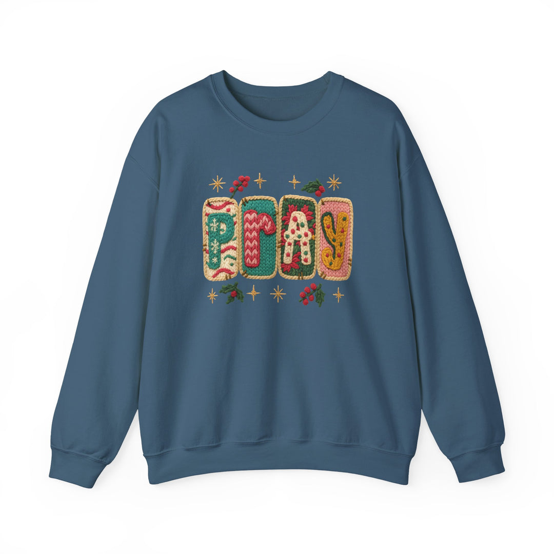 Slate-blue Pray Crew sweatshirt featuring festive, holiday-themed knitted graphics and Christmas motifs, offering a cozy and stylish option for colder months.