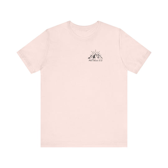A white t-shirt featuring a logo with mountains and sun, embodying the title Faith Can Move Mountains Tee from Worlds Worst Tees. Unisex jersey tee with ribbed knit collars, 100% Airlume combed cotton, and retail fit.