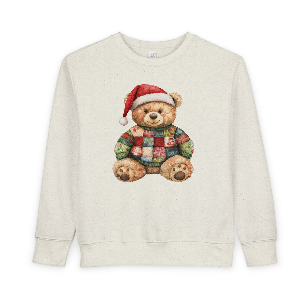 Christmas Bear Toddler Crew: Light-heathered sweatshirt with a teddy bear in a Santa hat and patchwork sweater, designed for warmth and comfort.