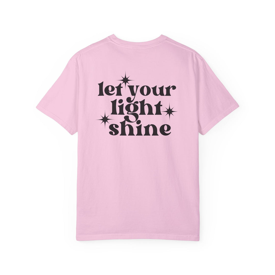 Relaxed fit Let Your Light Shine Tee, pink shirt with black text. 100% ring-spun cotton, garment-dyed for coziness. Double-needle stitching, no side-seams for durability and shape retention.
