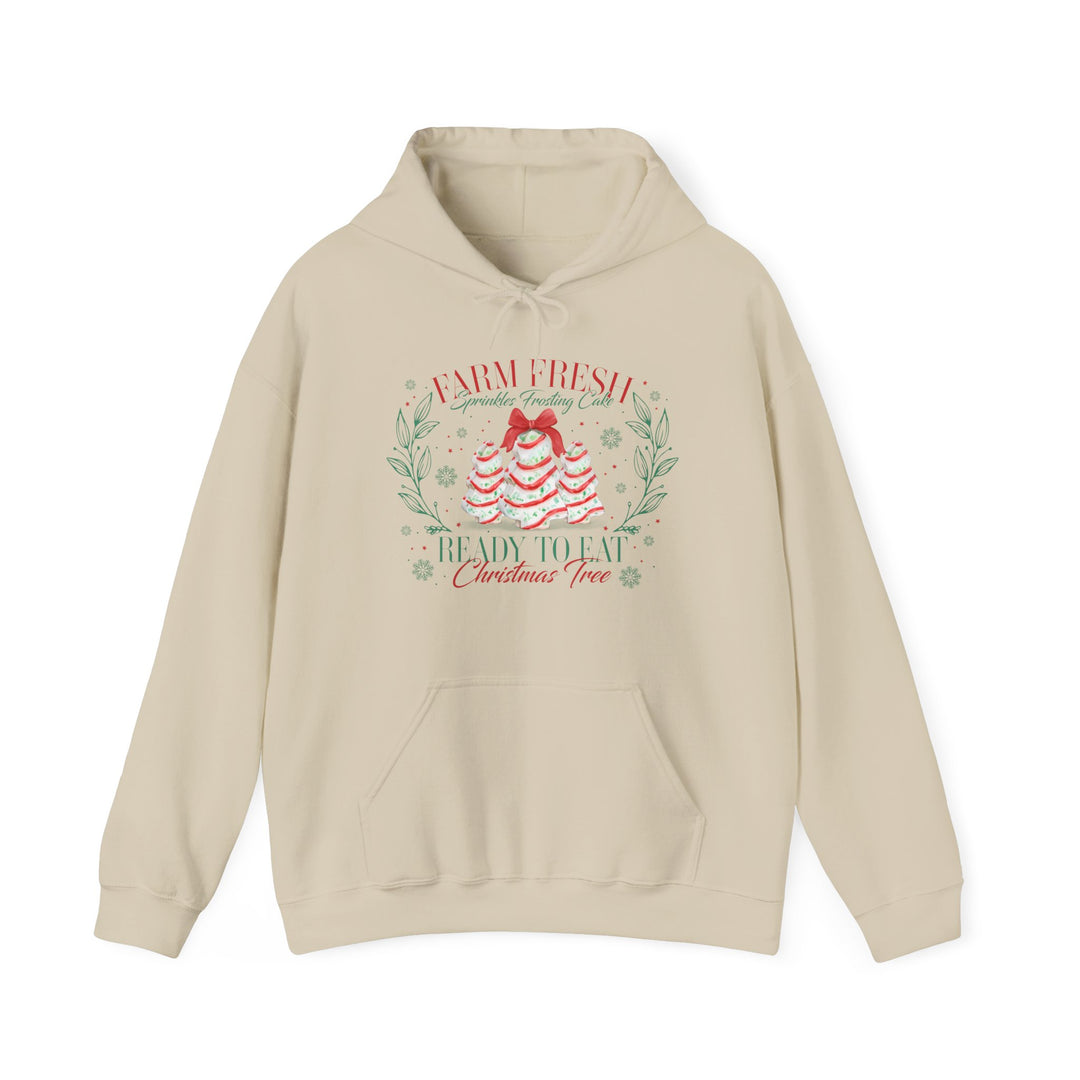 Light-beige Christmas Cookies Hoodie with frosted cake tree graphic, leafy wreath, and festive text, offering cozy warmth and style with a kangaroo pocket and matching drawstring.