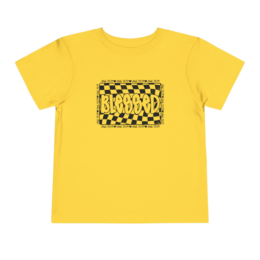 Blessed Toddler Tee: A yellow toddler t-shirt featuring a unique black and yellow design, made from 100% Airlume cotton for comfort.