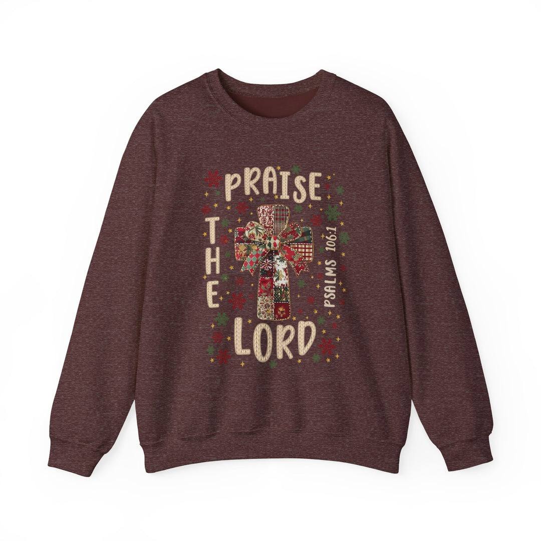 Praise the Lord Crew sweatshirt features a patchwork cross with holiday motifs, scripture reference, and festive colors; cozy, durable, and ethically made.