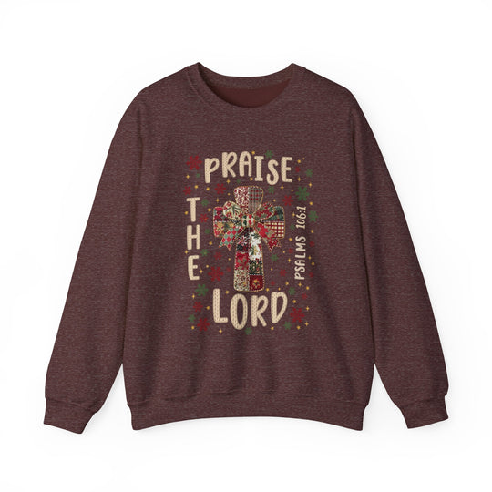 Praise the Lord Crew sweatshirt features a patchwork cross with holiday motifs, scripture reference, and festive colors; cozy, durable, and ethically made.