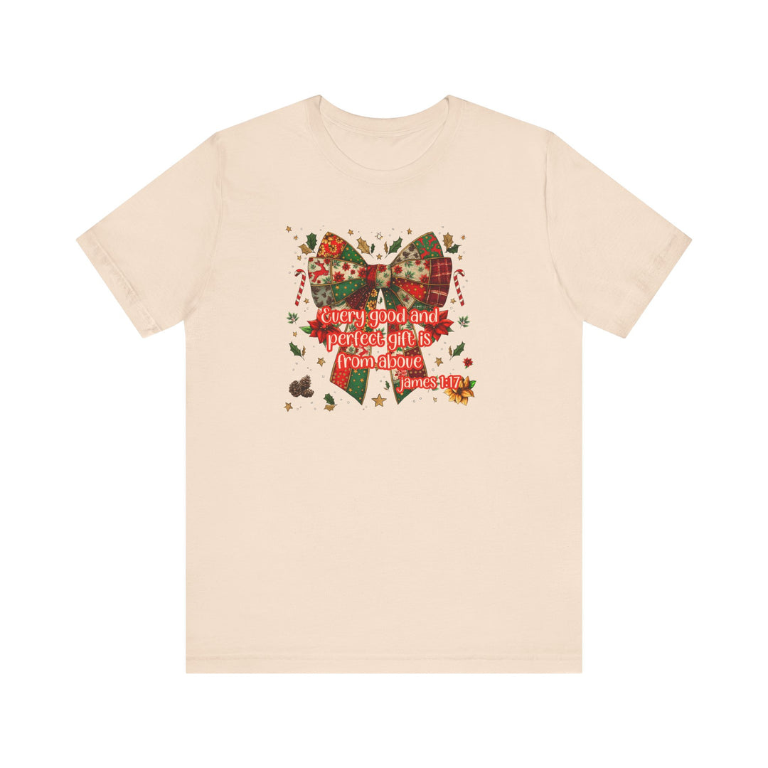 Gift from Above Tee featuring a patchwork Christmas bow design with festive elements and scripture quote, offering a soft, classic fit.