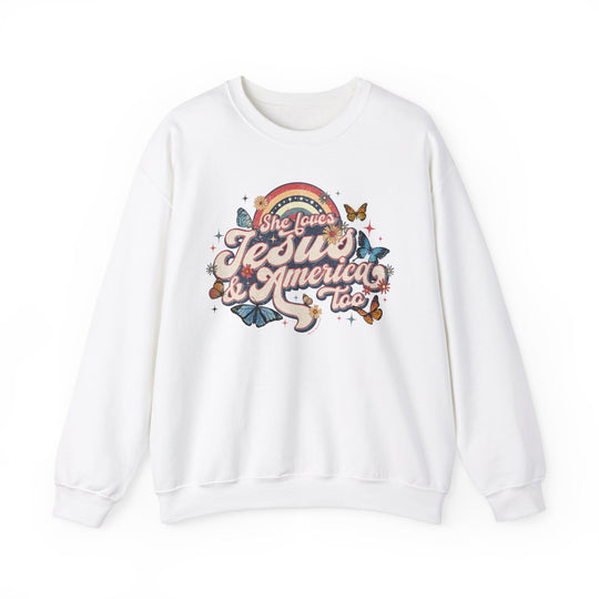 A white crewneck sweatshirt with a graphic design of butterflies and flowers. Unisex heavy blend for comfort, ribbed knit collar, no itchy seams. She Loves Jesus and America Crew.