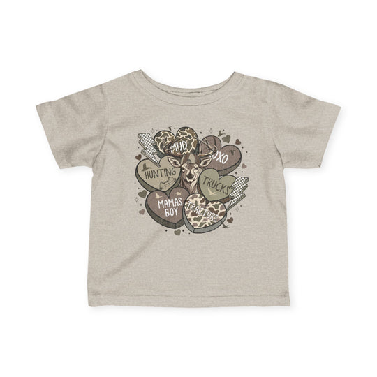 Boy Valentine Baby Tee featuring rustic hearts, lightning bolts, and a deer graphic. Includes phrases like MUD and XOXO, in a playful, outdoorsy style.