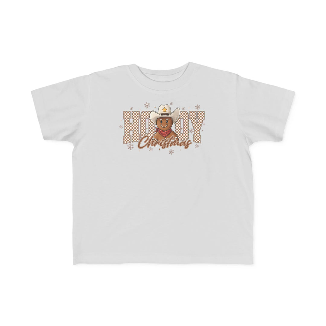 Howdy Christmas Toddler Tee featuring a gingerbread cookie in a cowboy hat, surrounded by snowflakes, with Howdy Christmas text. Soft, durable, perfect for toddlers.