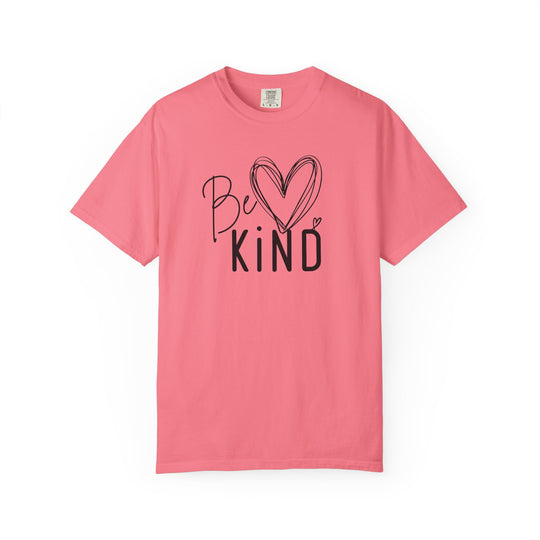 Solid-pink Be Kind Tee featuring a hand-drawn heart and bold text on the chest, designed for comfort with a relaxed fit.