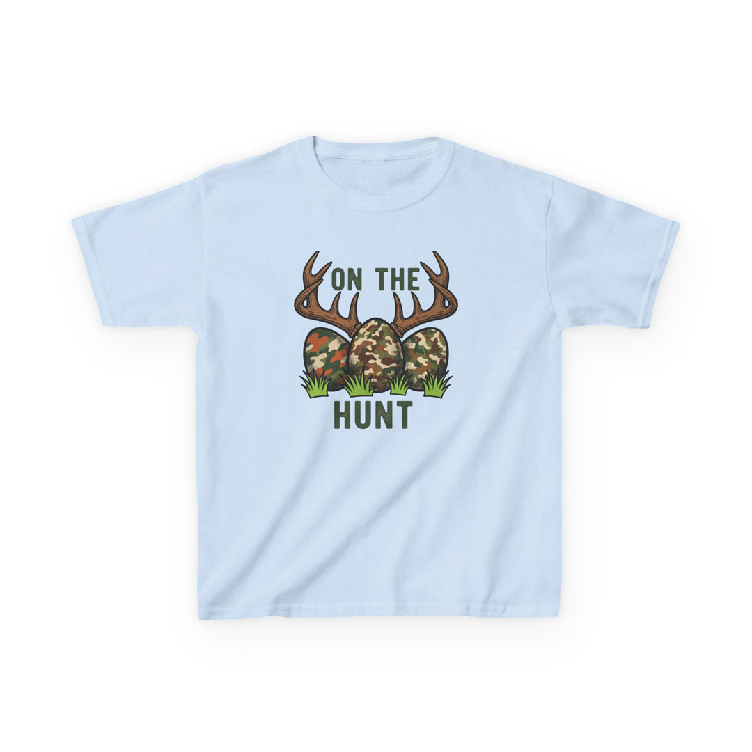Light-blue On the Hunt Kids Tee with camo eggs, deer antlers, playful Easter-hunting graphic. Durable cotton, perfect for everyday wear.