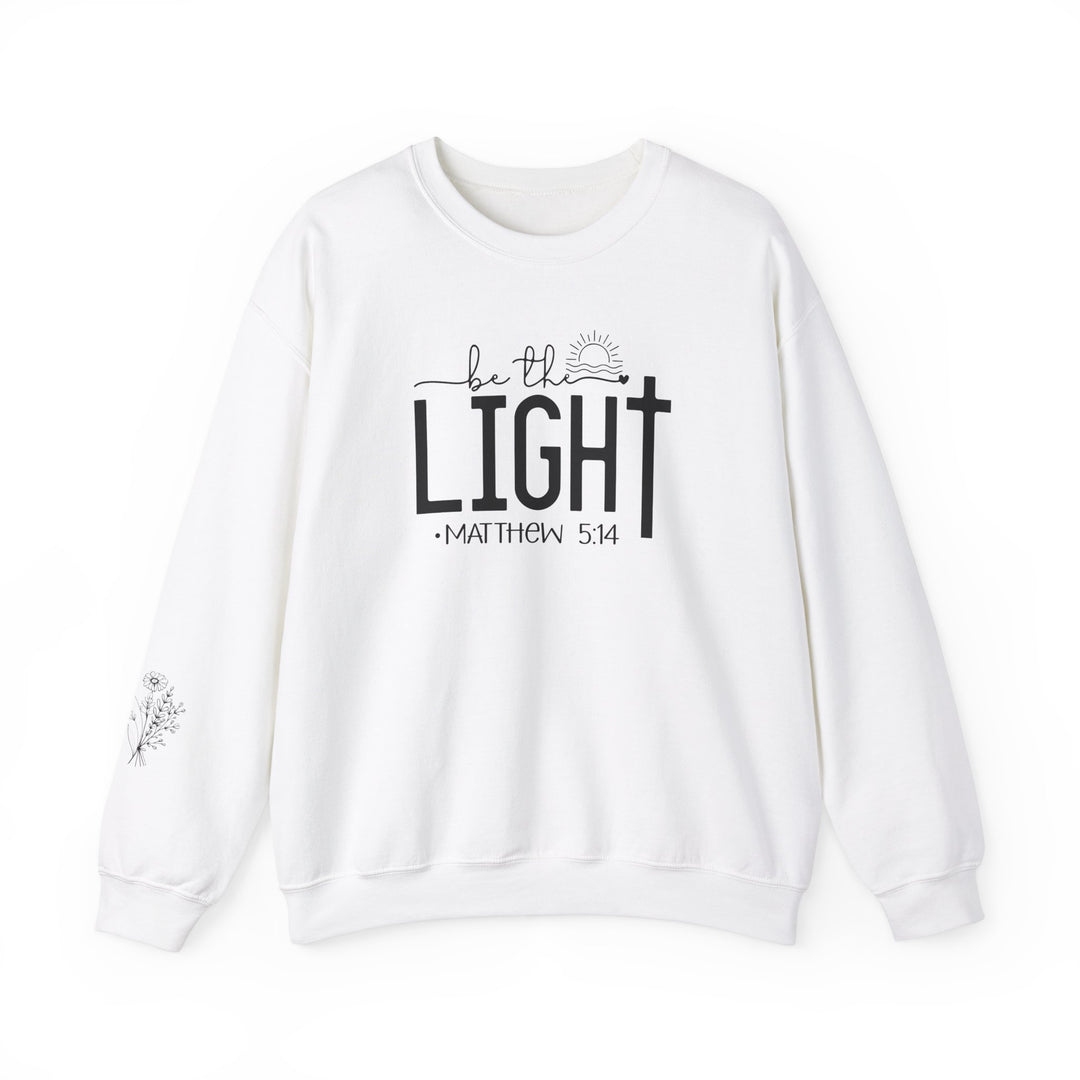 A unisex heavy blend crewneck sweatshirt, the Be the Light Crew, offers comfort with a ribbed knit collar and durable double-needle stitching. Made from 50% cotton and 50% polyester, ideal for colder months. Ethically grown US cotton.