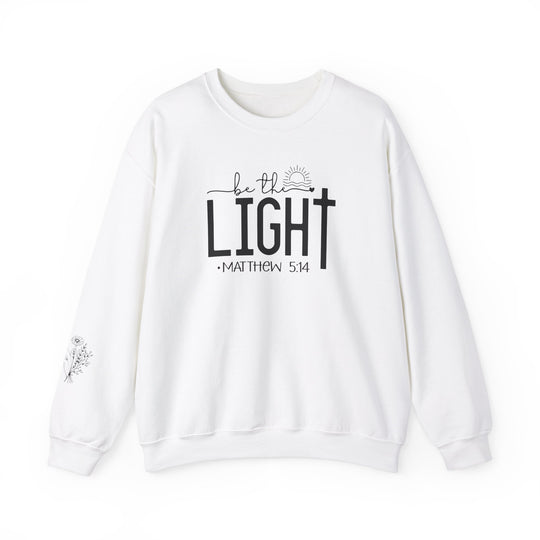A unisex heavy blend crewneck sweatshirt, the Be the Light Crew, offers comfort with a ribbed knit collar and durable double-needle stitching. Made from 50% cotton and 50% polyester, ideal for colder months. Ethically grown US cotton.