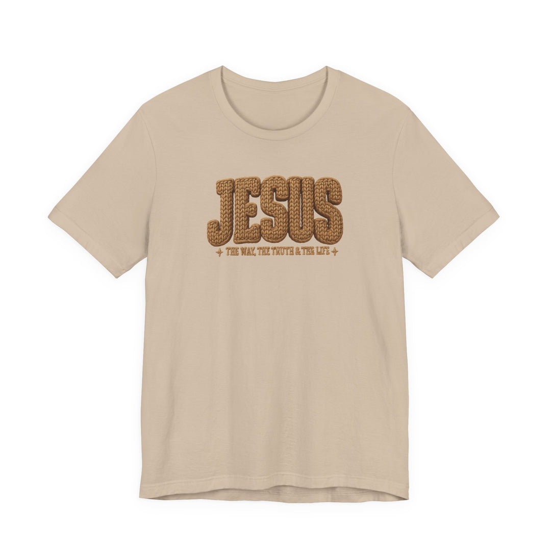 Light beige T-shirt with JESUS in rope-style lettering and The Way, The Truth & The Life beneath, featuring decorative crosses.