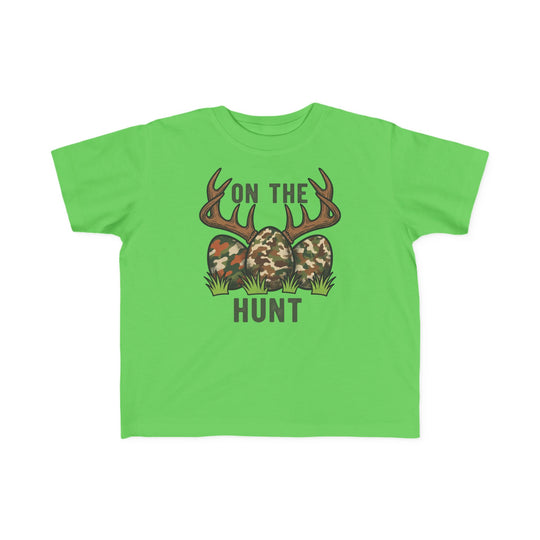 On the Hunt Toddler Tee featuring camo eggs and deer antlers graphic, ideal for sensitive skin with its soft, durable cotton fabric, perfect for toddlers.