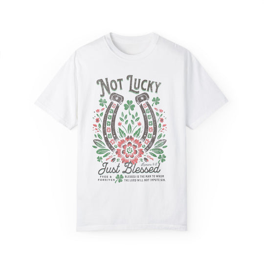 Blessed Tee: White t-shirt featuring a graphic design with a horseshoe, flowers, and leaves. Made from soft, durable, ring-spun cotton for everyday comfort.
