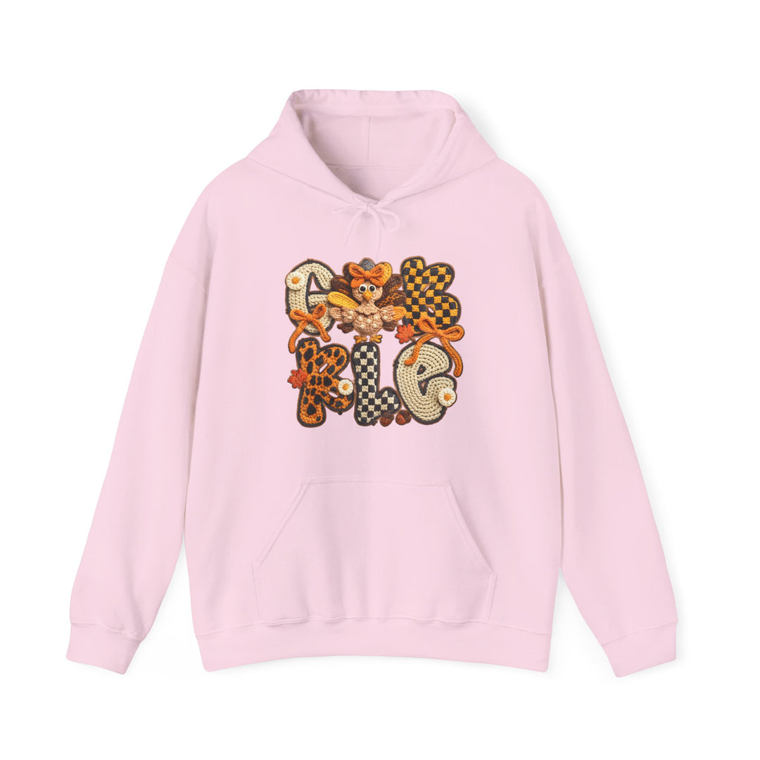 Pale-pink Gobble Hoodie with GIVE THANKS applique, cartoon turkey, and autumn leaves. Features kangaroo pocket and drawstring hood, perfect for cozy, stylish wear.