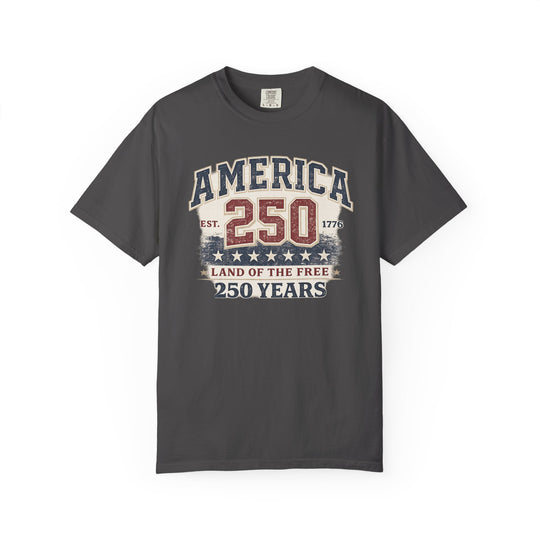 America 250 Years Tee featuring a vintage patriotic graphic with AMERICA 250, EST. 1776, and LAND OF THE FREE on a dark-gray crew-neck T-shirt.